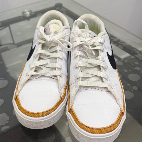 Nike Shoes - Nike White and Black Sneakers with Gold Accents